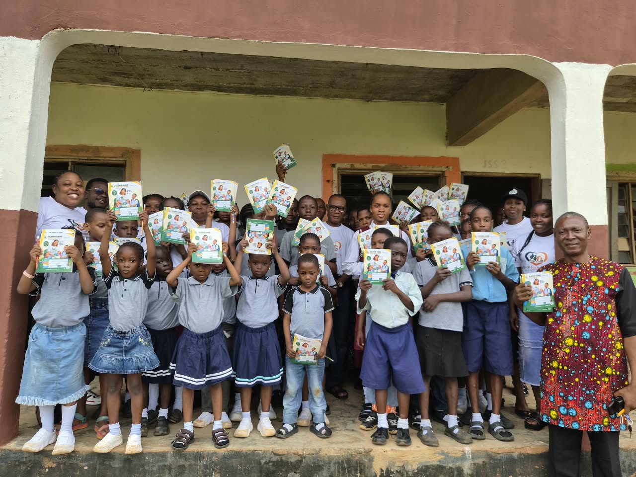Students smiling together during an Elerio Care Foundation school outreach