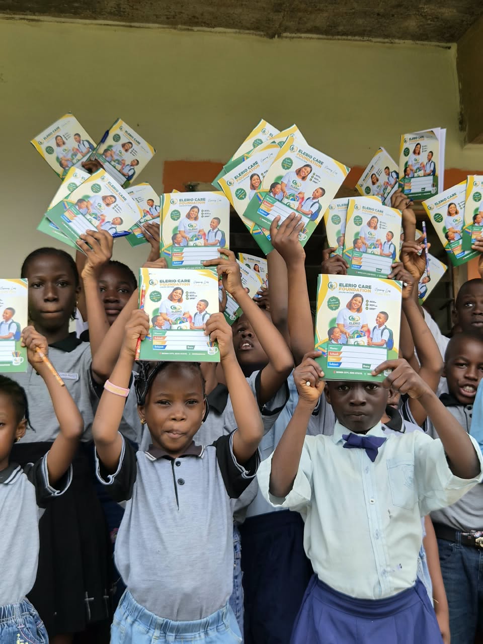 Schoolchildren holding new learning materials
