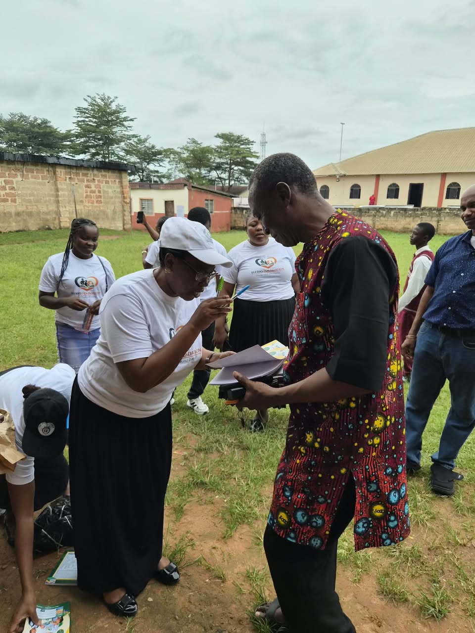 Elerio volunteers working with members of a local community