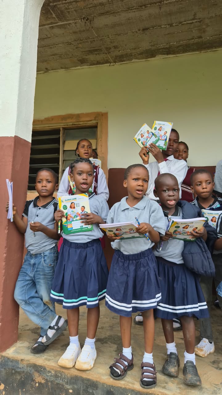 Children showing their new learning materials